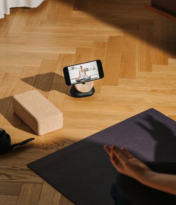 Woman practicing yoga on a dark background with lime accents
